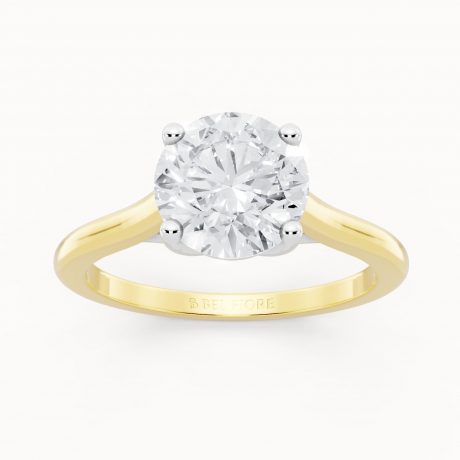 Brilliant round cut center diamond in classic prongs- White Head