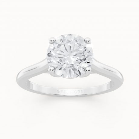 Brilliant round cut center diamond in classic prongs- White Gold