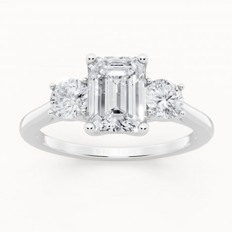Emerald cut center with two round side stones -White Gold