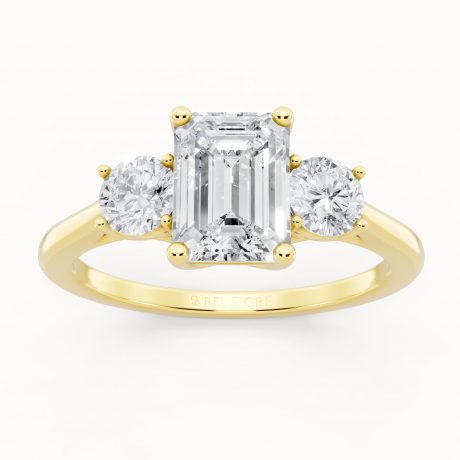 Emerald cut center with two round side stones -Yellow Gold